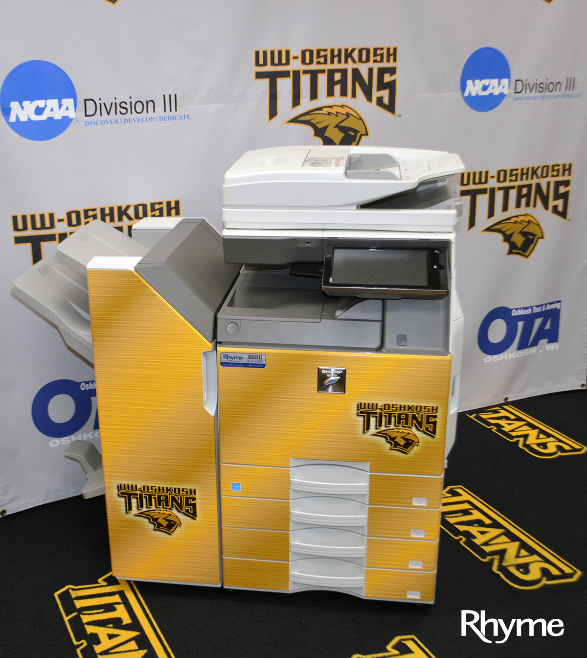 Sharp MFP with UW-Oshkosh Titans wrap on it