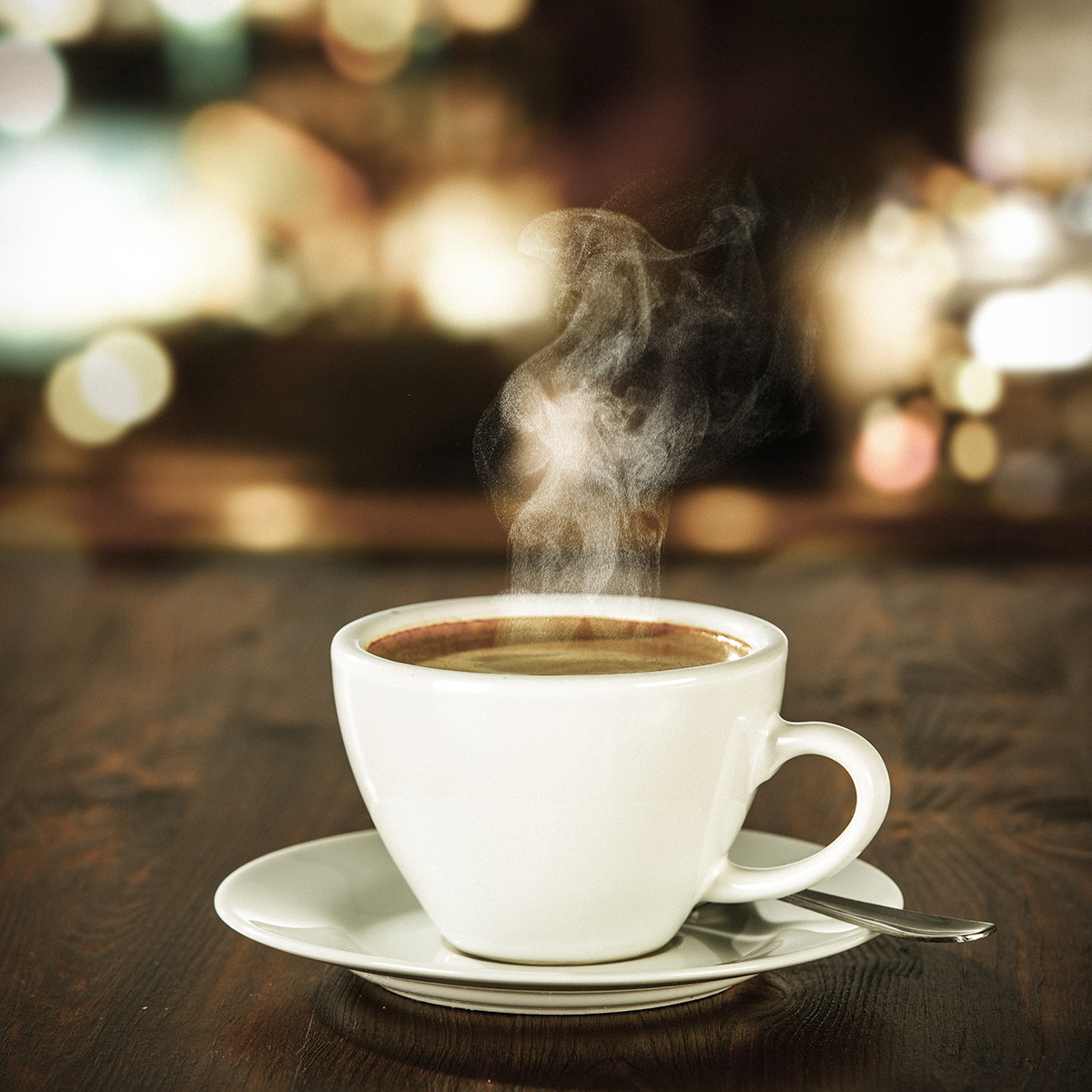 Coffee in a white mug steaming