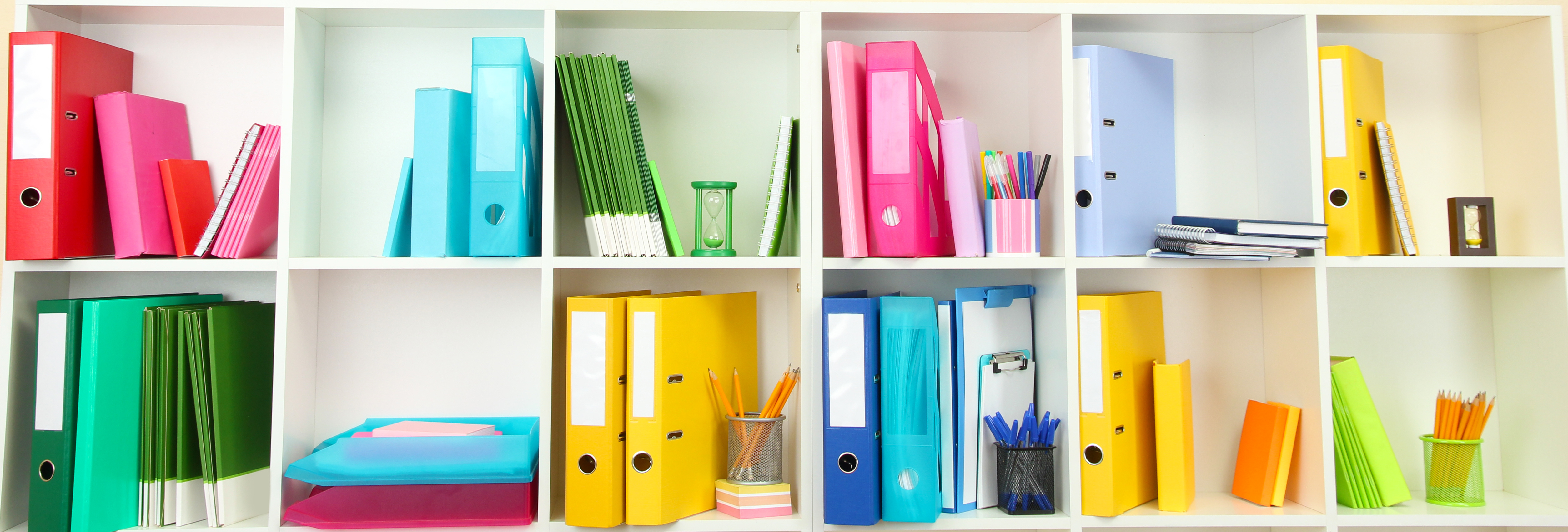 Colorful binders, pens, notebooks, and organizers