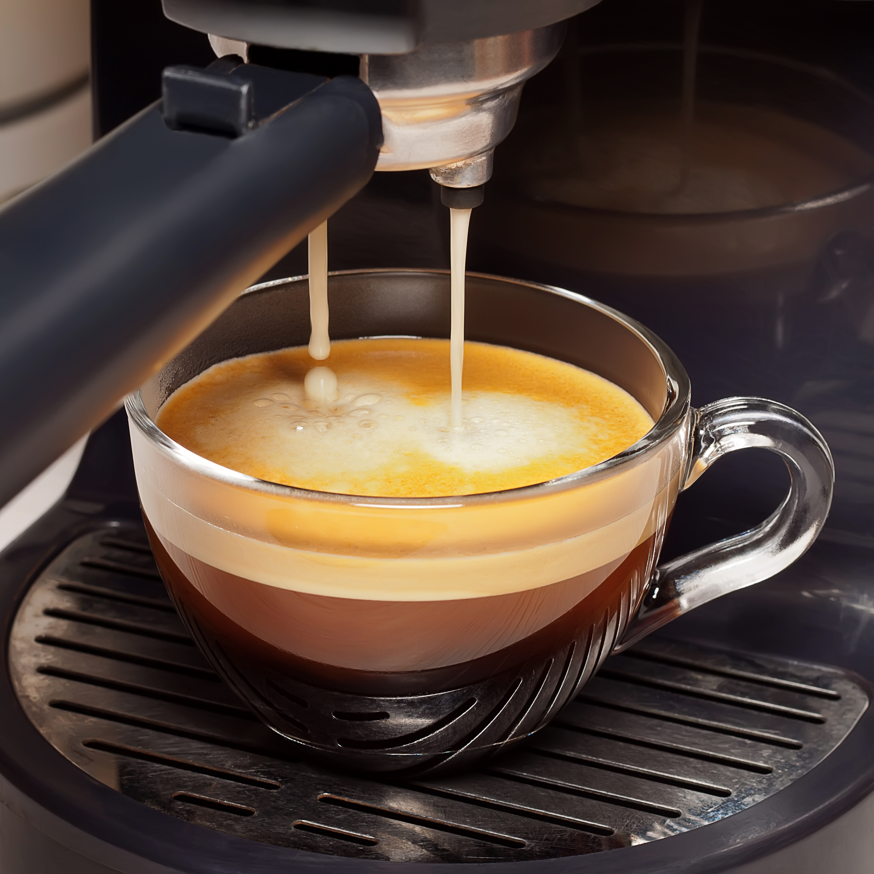 Coffee Maker dispensing coffee into mug