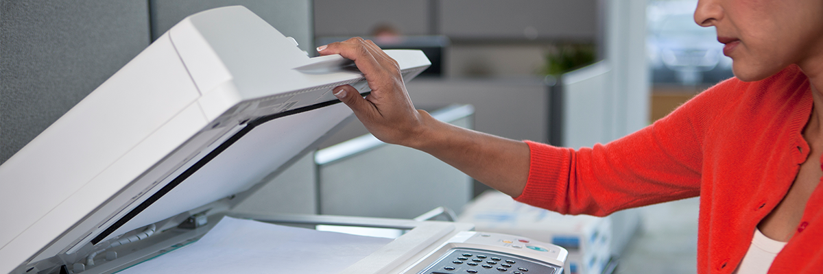 Employee scanning a document on a Xerox MFP with CapturePoint App